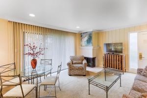 a living room with a glass table and chairs at Silverado Resort and Spa II in Napa