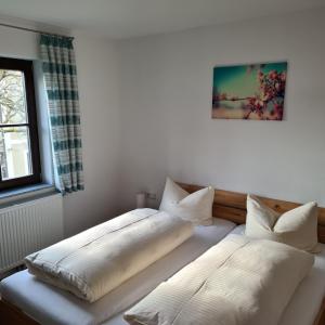 Postel nebo postele na pokoji v ubytování Gasthaus Schöllmann