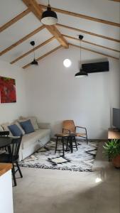 a living room with a couch and a table at Apartment Ariela in Izola