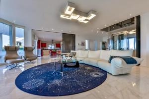 A seating area at CORAL- Managed by Almarina Villas