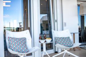 A seating area at CORAL- Managed by Almarina Villas