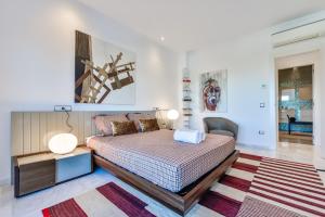 A bed or beds in a room at CORAL- Managed by Almarina Villas