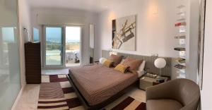 A seating area at CORAL- Managed by Almarina Villas
