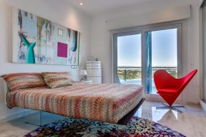 A bed or beds in a room at CORAL- Managed by Almarina Villas
