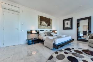 A bed or beds in a room at CORAL- Managed by Almarina Villas