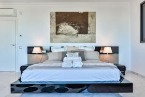 A bed or beds in a room at CORAL- Managed by Almarina Villas