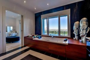 A bathroom at CORAL- Managed by Almarina Villas