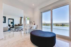 A seating area at CORAL- Managed by Almarina Villas