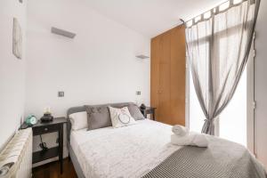 Postel nebo postele na pokoji v ubytování El Olivar de la Paz Madrid Centro