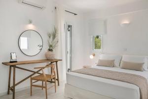 מיטה או מיטות בחדר ב-Lourdas White Villa