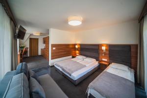 Ένα ή περισσότερα κρεβάτια σε δωμάτιο στο GORSKI RESORT Lux Apartments Jacuzzi & Sauna +182 φωτογραφίες