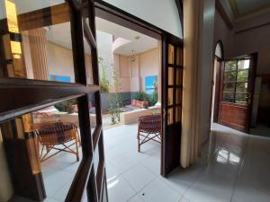 a view of a dining room with a table and chairs at Enjoy Luxor in Luxor