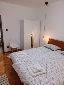 Postel nebo postele na pokoji v ubytování Lopica