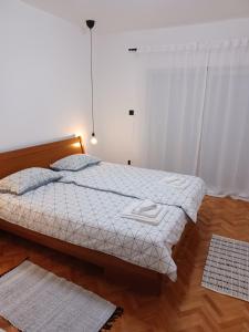 Postel nebo postele na pokoji v ubytování Lopica
