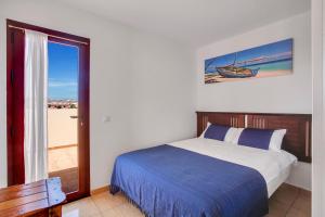 A bed or beds in a room at VILLA SOL