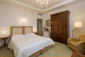 Postel nebo postele na pokoji v ubytování Roccafiore Wine Resort & Spa