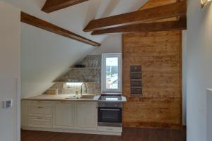 Kuchyň nebo kuchyňský kout v ubytování Blatenský House 393 - Apartmá 3