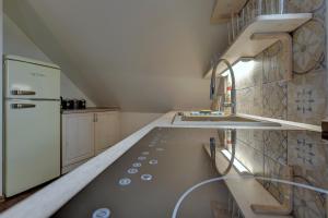 Kuchyň nebo kuchyňský kout v ubytování Blatenský House 393 - Apartmá 3