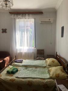 Tempat tidur dalam kamar di Rimma Homestay