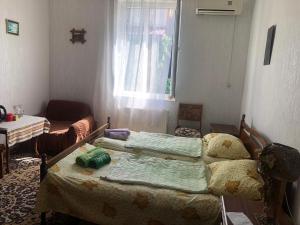 Tempat tidur dalam kamar di Rimma Homestay