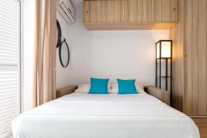 A bed or beds in a room at Livemálaga San Telmo Beach