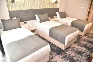 Postel nebo postele na pokoji v ubytování Yeşilyurt Park Otel