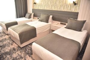 Postel nebo postele na pokoji v ubytování Yeşilyurt Park Otel