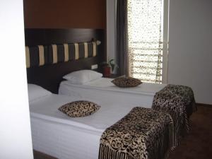 Postel nebo postele na pokoji v ubytování Hotel Sydney