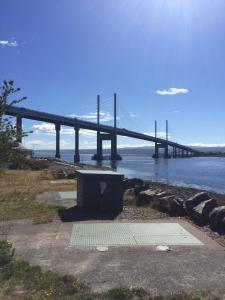 a bridge over a body of water with a box at Tigh mo Ghraidh ( House of my love) in Inverness