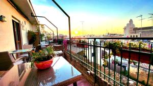 a balcony of a building with potted plants on it at Attico Barocco in Lecce