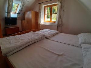 Posteľ alebo postele v izbe v ubytovaní Lachtalhütte