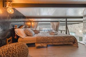 a bedroom with a large bed and a table at BUNGALOW private pool bbq air conditioning stunning ocean view in Adeje +55 photos