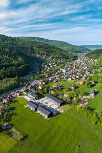an aerial view of a small town in the hills at WILANESKA Apartament Olimpijska Szczyrk in Szczyrk