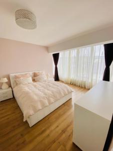 La maison de macarons, your sweet home in Cluj tesisinde bir odada yatak veya yataklar