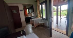 a view of a kitchen with a view of a patio at Golden view apartments Myrina Limnos in Mirina +69 photos