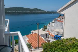 a view of the water from the balcony of a building at Apartments Knežević in Neum