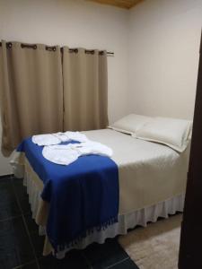 Katil atau katil-katil dalam bilik di Casa Aconchegante na Roça - Roseli