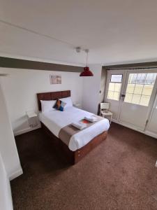 a bedroom with a large bed in a room at Horizon in Brighton & Hove
