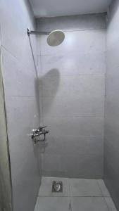 a shower with a glass door with a sink in a bathroom at Hadayek Al-Ahram Guest House - حدائق الاهرام جيست هاوس in 6th Of October +25 photos
