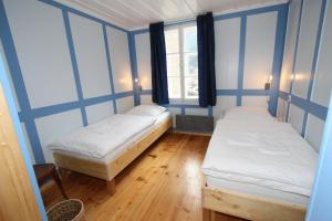 Ein Bett oder Betten in einem Zimmer der Unterkunft Chalet Hotel Krone