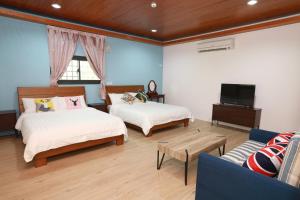 Postel nebo postele na pokoji v ubytování 小葉園民宿Little Ya B&B