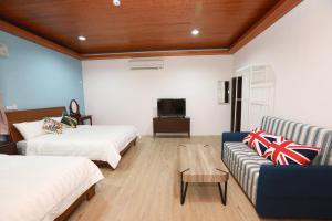 Postel nebo postele na pokoji v ubytování 小葉園民宿Little Ya B&B