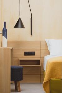 Essentia Vita Comfy Suites客房内的一张或多张床位