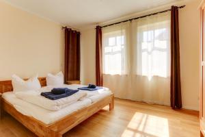Ένα ή περισσότερα κρεβάτια σε δωμάτιο στο Strandvilla Börgerende