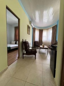 Ένα ή περισσότερα κρεβάτια σε δωμάτιο στο ALEM Hotel