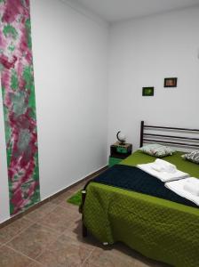 En eller flere senger på et rom på Mansão Alentejana AL