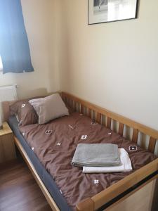 Postel nebo postele na pokoji v ubytování KT Zenit Vendégház Eger