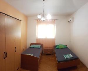 Postel nebo postele na pokoji v ubytování Eros Rooms