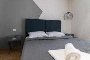En eller flere senger på et rom på Stamatina's Luxury Apartment (Little Suite)