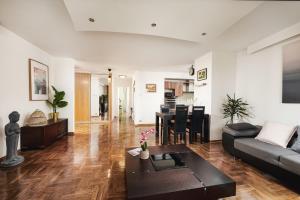 a living room with a couch and a table at Lumina I Spacious 3BR Apartment with Parking I Balcony I Warszawa Zachodnia in Warsaw +18 photos
